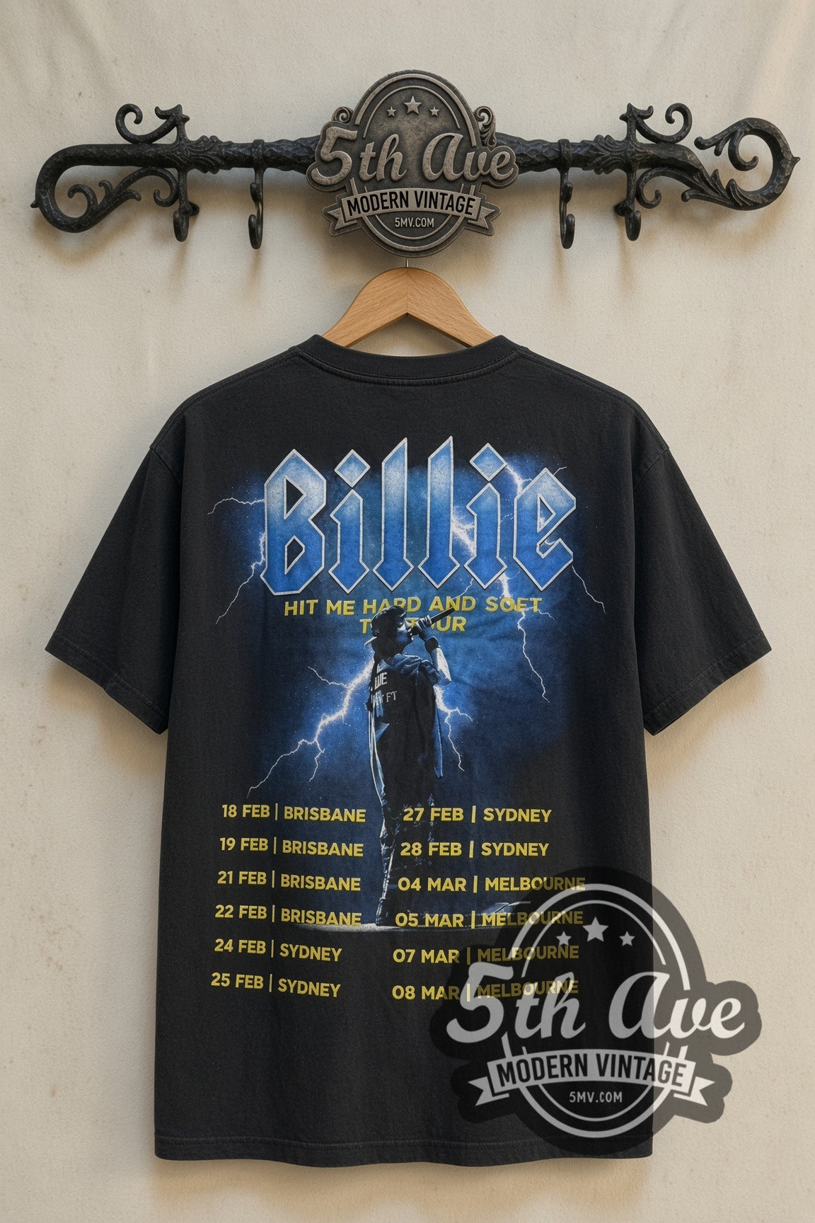 Back print of Billie Eilish Hit Me Hard and Soft Tour Collage & Dates tee on 5th Ave rack