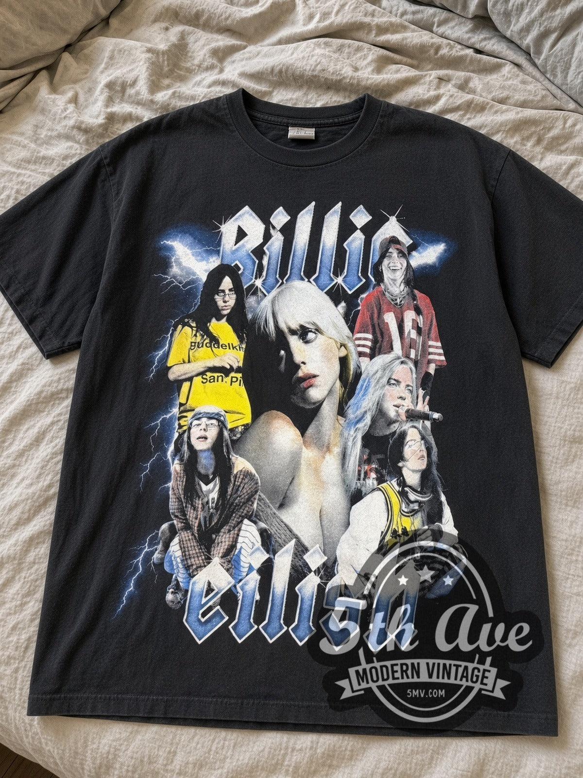 Faded black Billie Eilish Hit Me Hard and Soft Tour Collage & Dates tee laid flat on linen bed