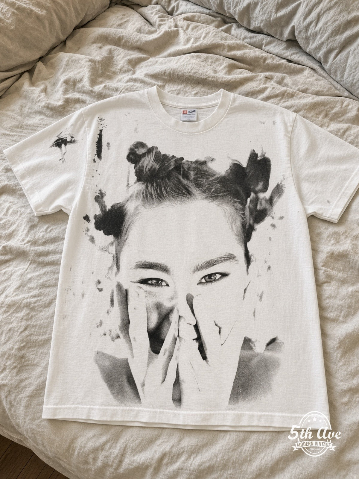 Björk It Takes Courage to Enjoy It vintage tee laid on bed
