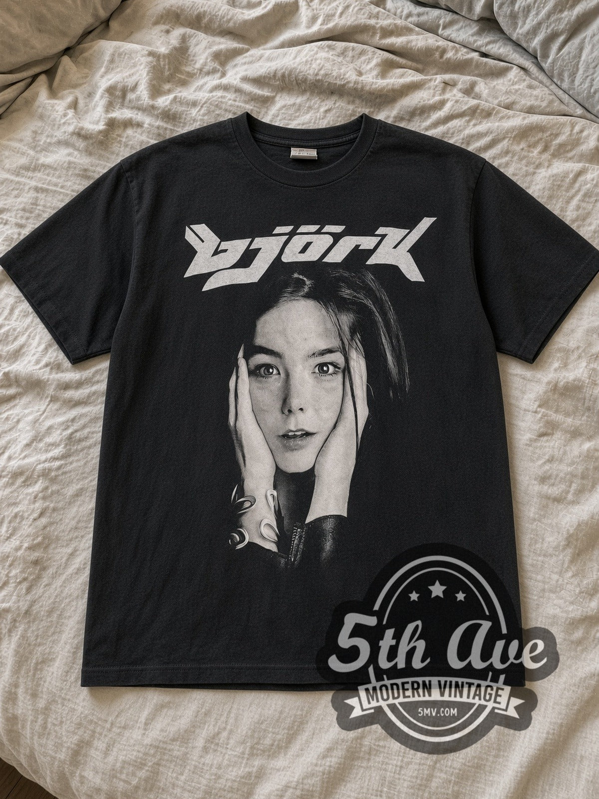 Black Björk Photo Monochrome Vintage Band T-Shirt laid flat on a linen bed