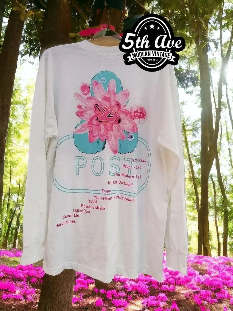 Bjork Post Album Long Sleeve T-Shirt vintage t-shirt laid on bed