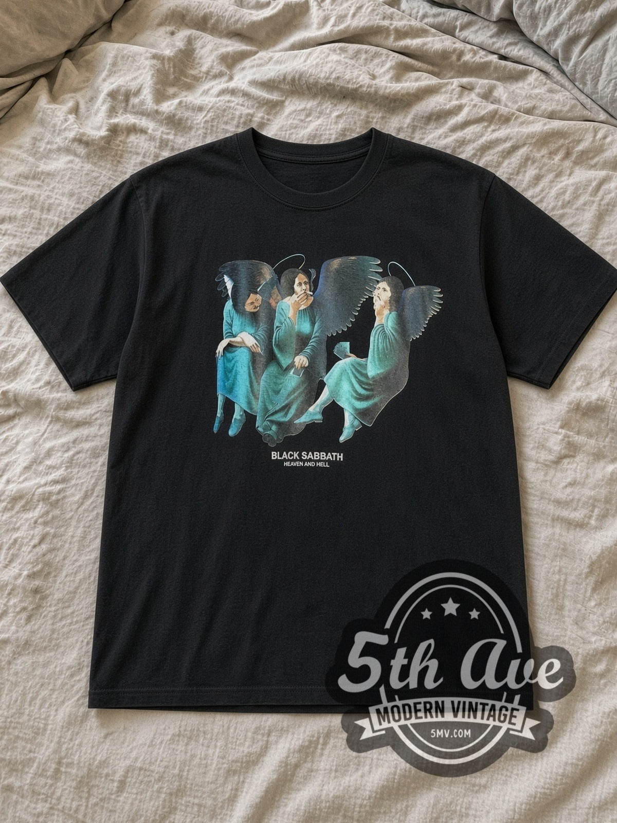 Black Black Sabbath Heaven and Hell Vintage Band T-Shirt laid flat on a linen bed