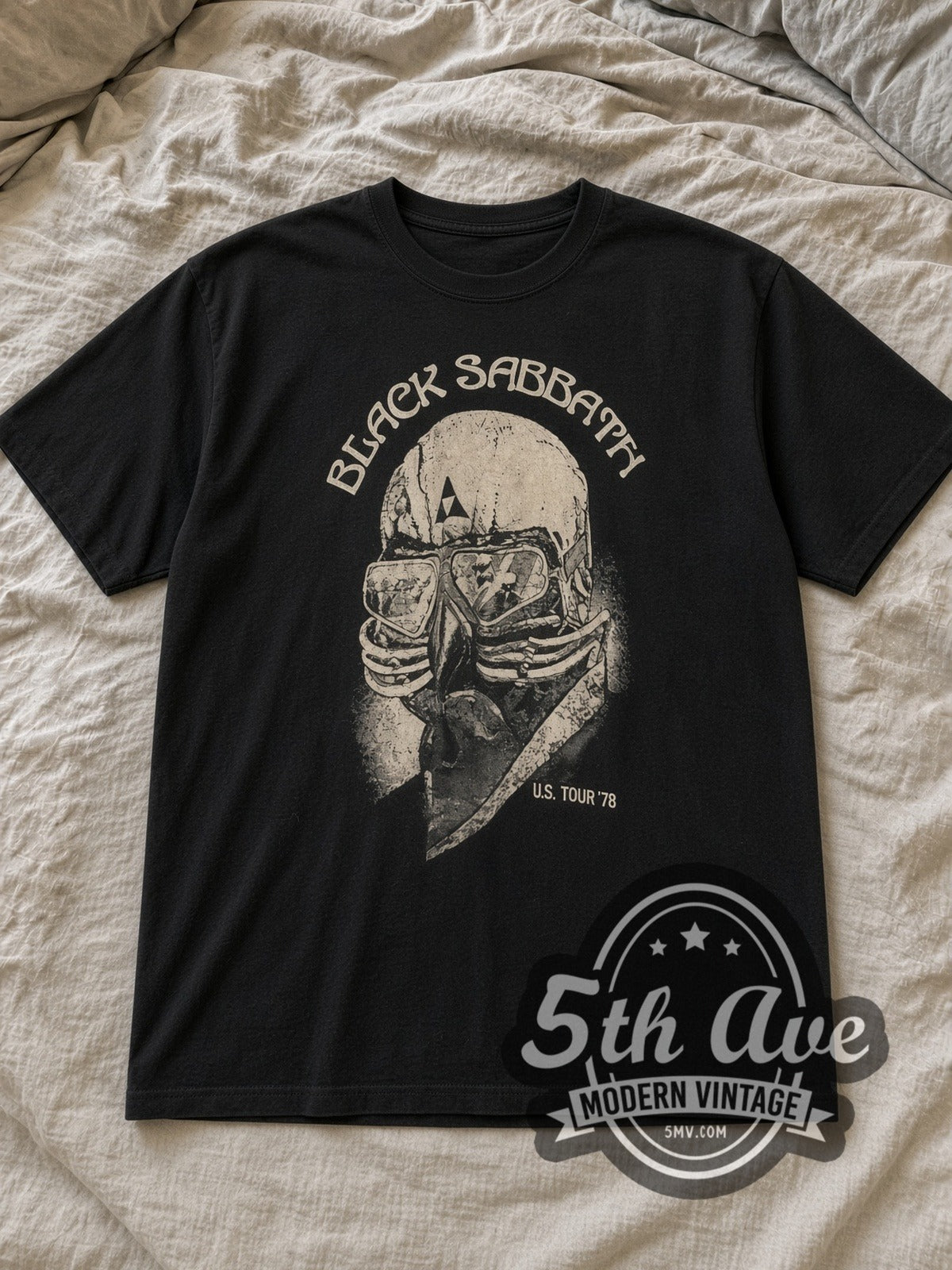 Black Black Sabbath U.S. Tour '78 Vintage Band T-Shirt laid flat on a linen bed
