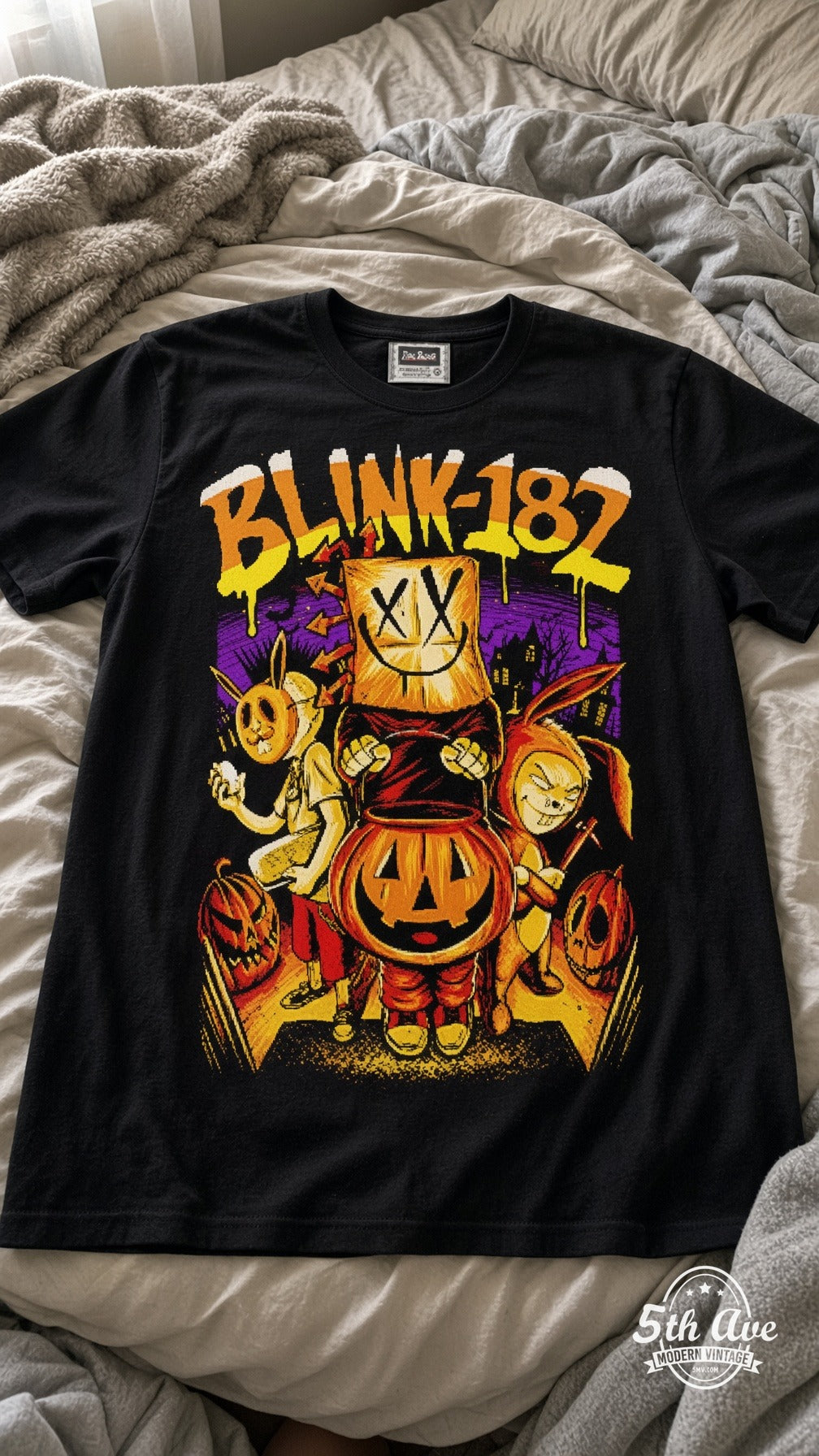 Blink-182 Halloween vintage t-shirt laid on bed