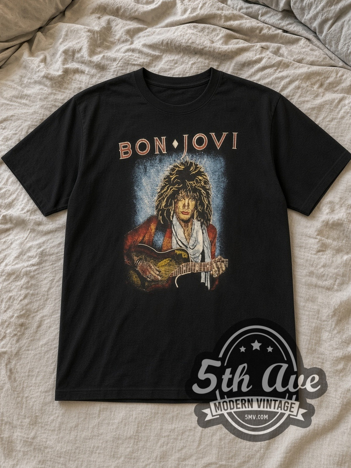 Black Bon Jovi Guitar Portrait Vintage Band T-Shirt laid flat on a linen bed