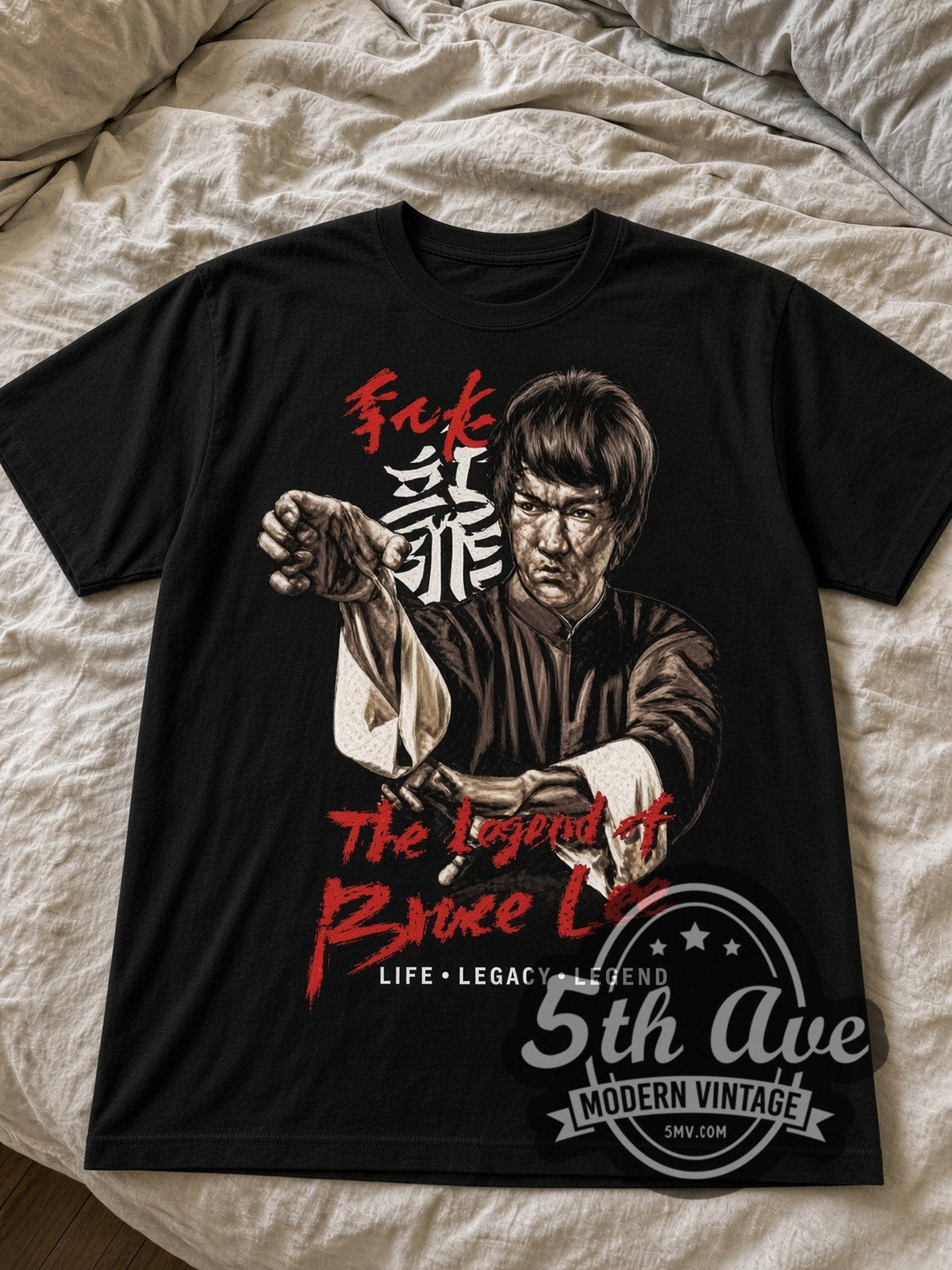 Bruce Lee Life Legacy Legend black graphic tee laid flat on linen bed