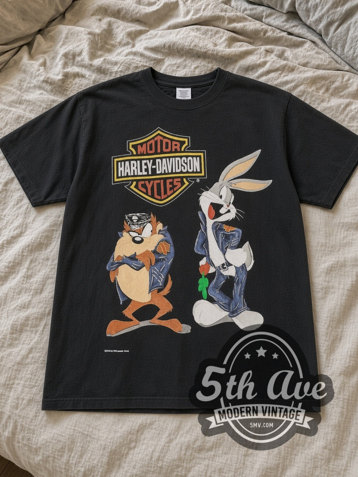 Black Harley Davidson Bugs Bunny & Taz Saints Butte MT Vintage Harley-Davidson T-Shirt laid flat on a linen bed