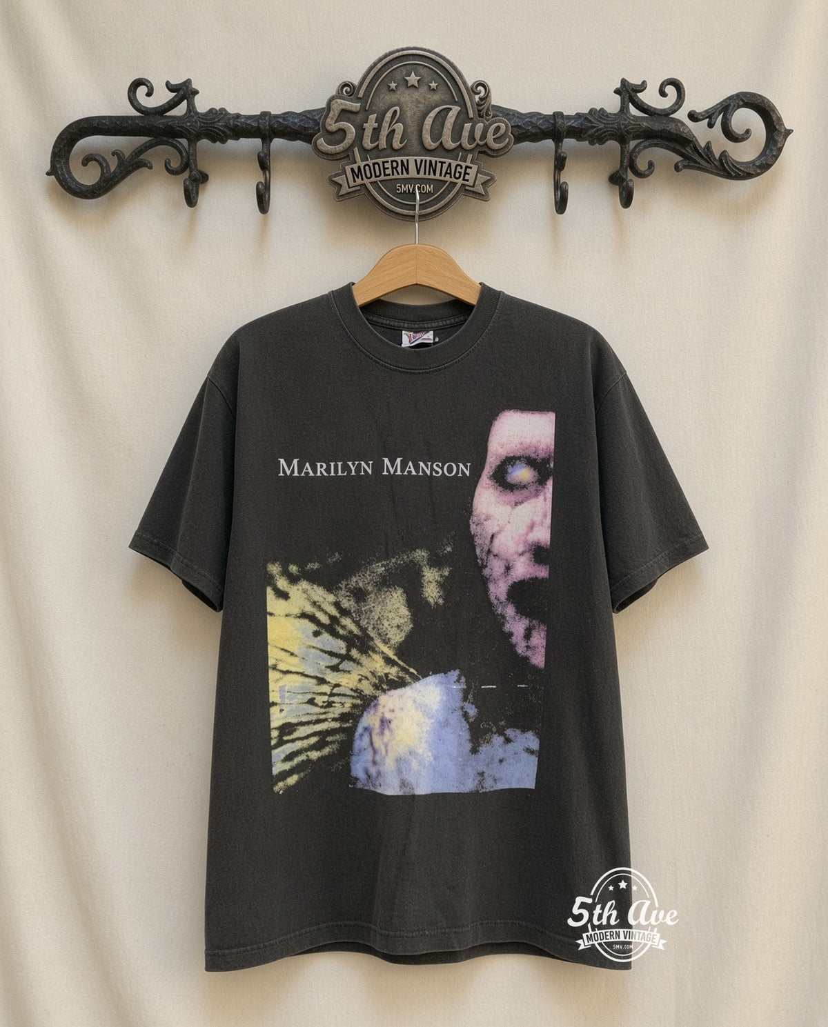 Captivating Marilyn Manson Graphic Tee: Embrace Iconic Style and Comfort vintage tee on 5th Ave cream rack — front