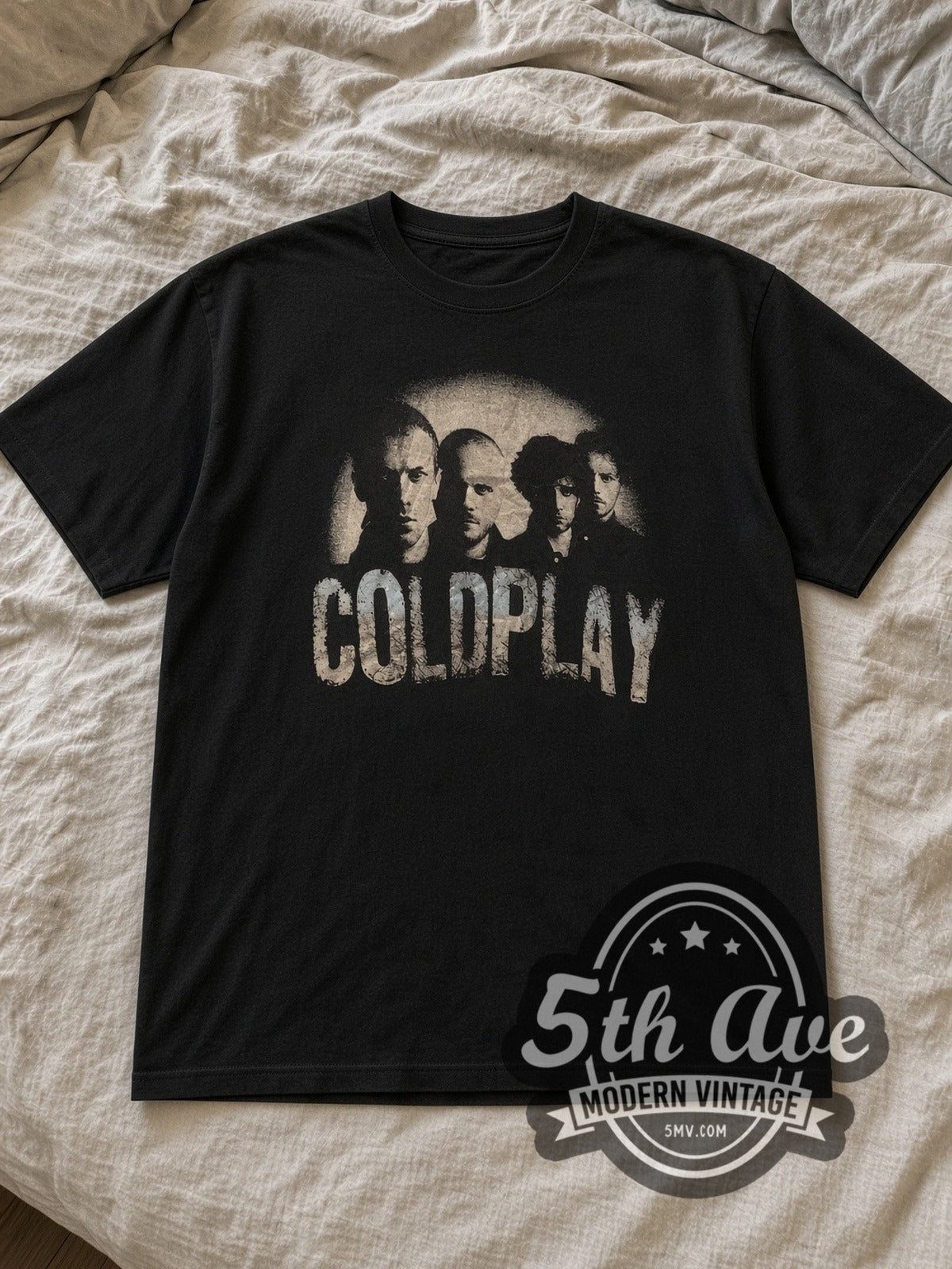 Black Coldplay Band Photo Logo Vintage Band T-Shirt laid flat on a linen bed