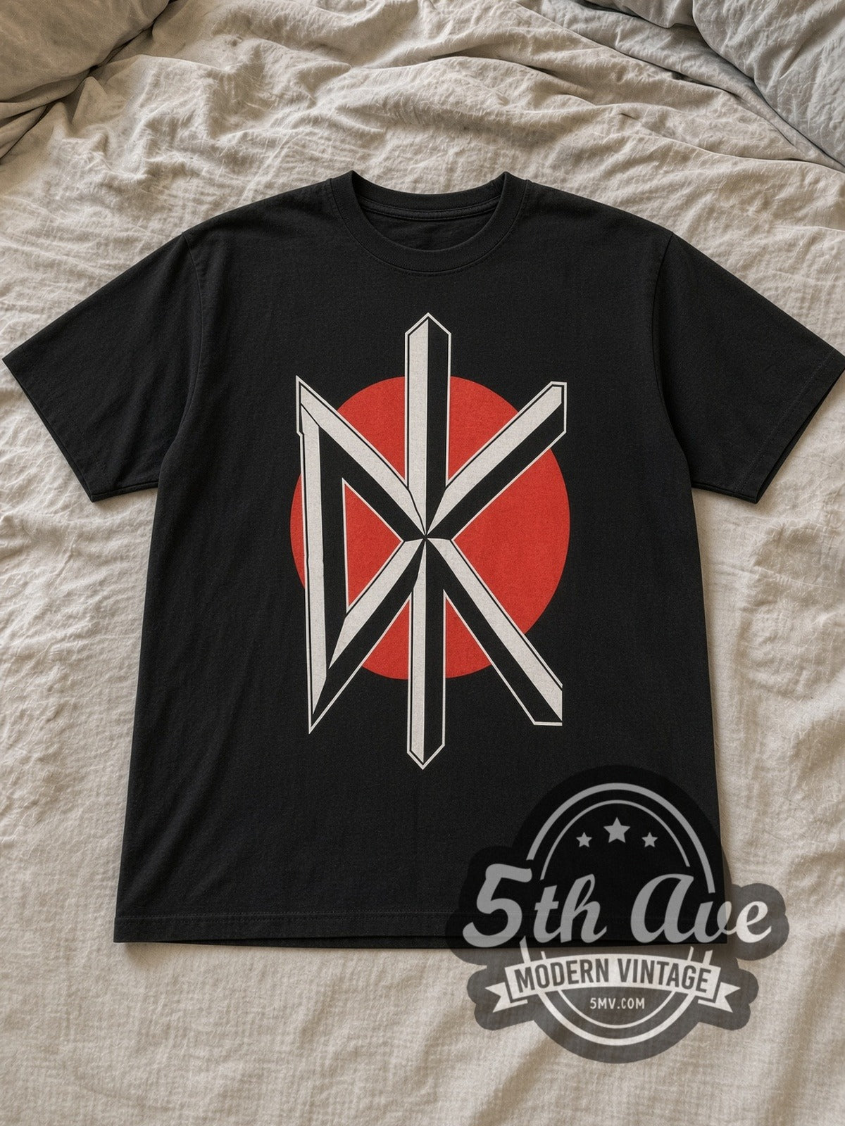 Black Dead Kennedys Vintage Band T-Shirt laid flat on a linen bed