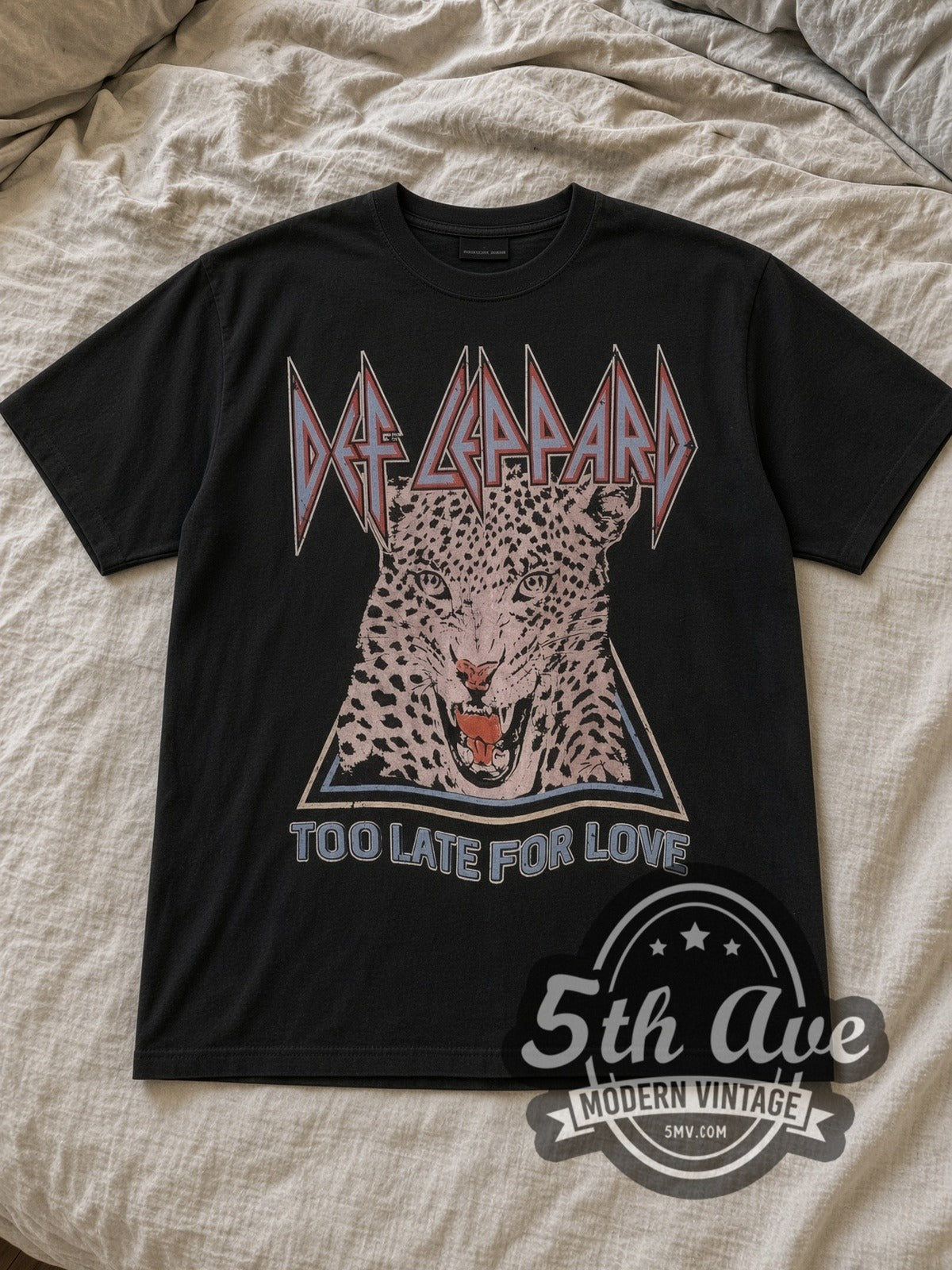 Black Def Leppard Pyromania '83 North American Tour Vintage Band T-Shirt laid flat on a linen bed