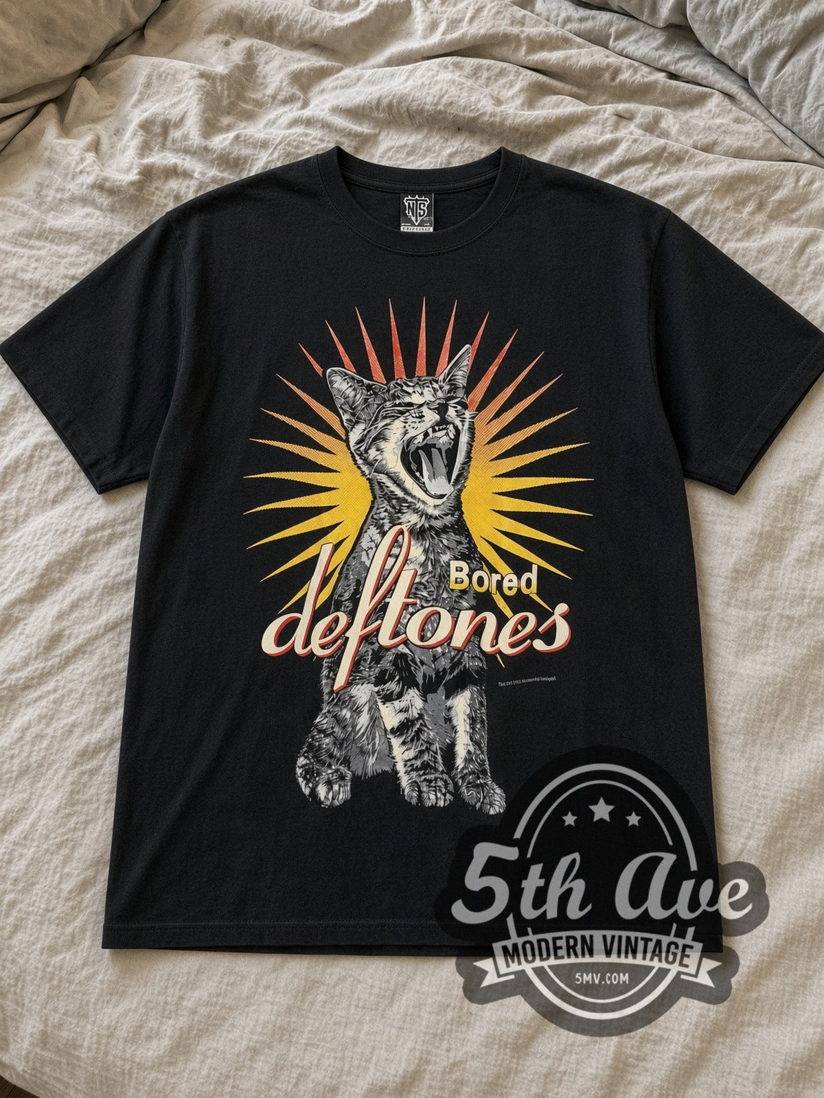 Black Deftones Bored Vintage Band T-Shirt laid flat on a linen bed