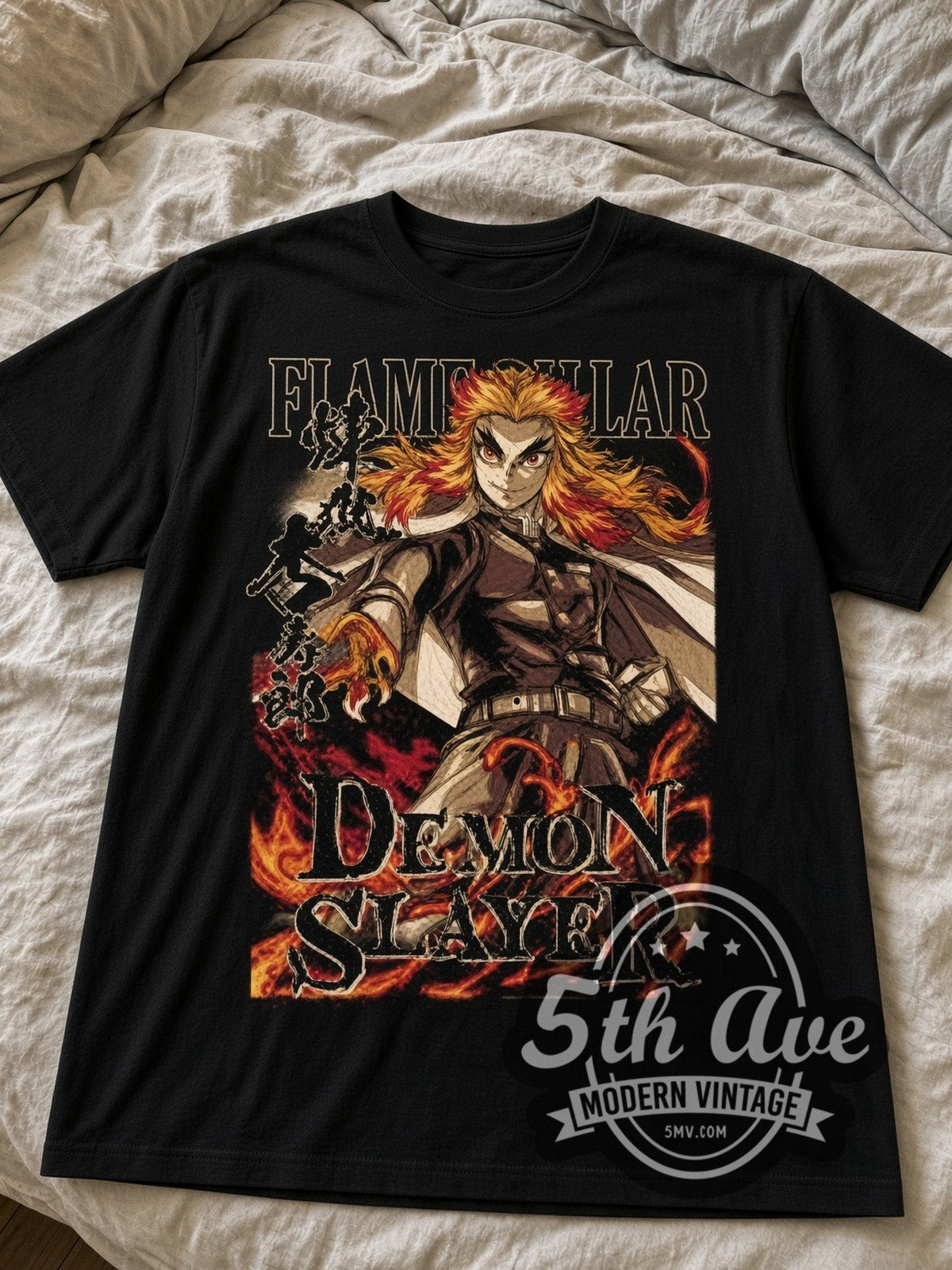 Demon Slayer Rengoku Flame Hashira black graphic tee laid flat on linen bed