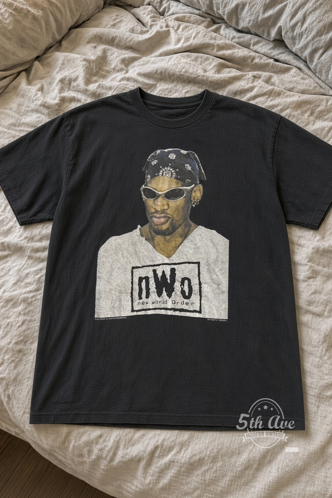 Dennis Rodman nWo New World Order Bandana vintage tee laid flat on bed