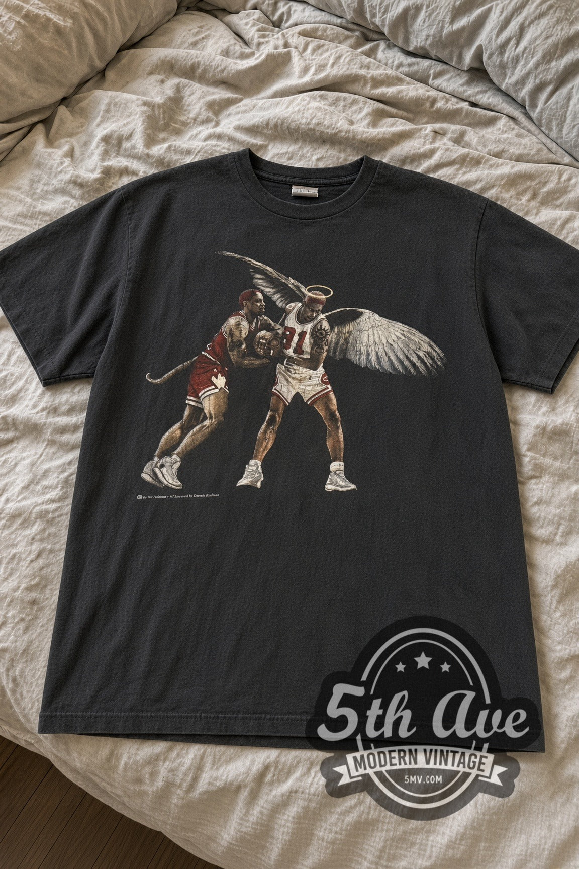 Dennis Rodman Winged Angel #91 Boxing Out vintage graphic tee laid flat on bed