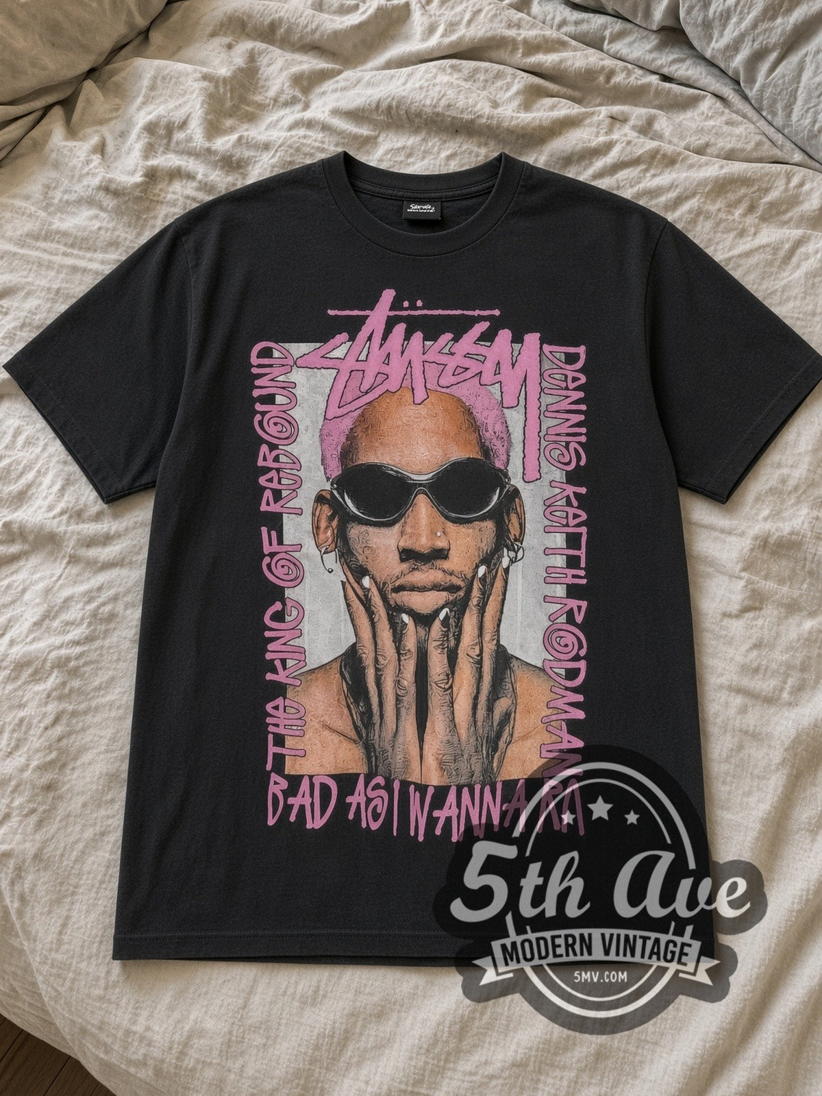 Black Dennis Rodman x Stüssy The King of Rebound Vintage Basketball T-Shirt laid flat on a linen bed