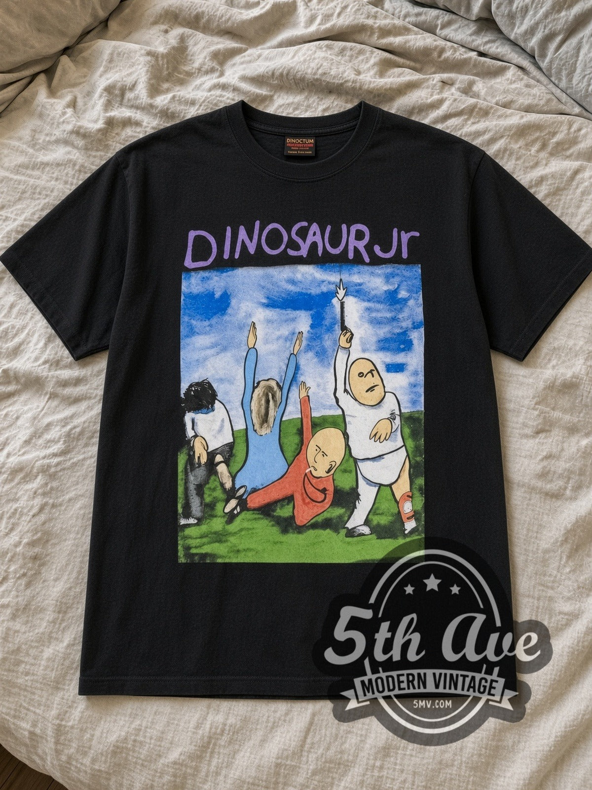 Black Dinosaur Jr. Vintage Band T-Shirt laid flat on a linen bed