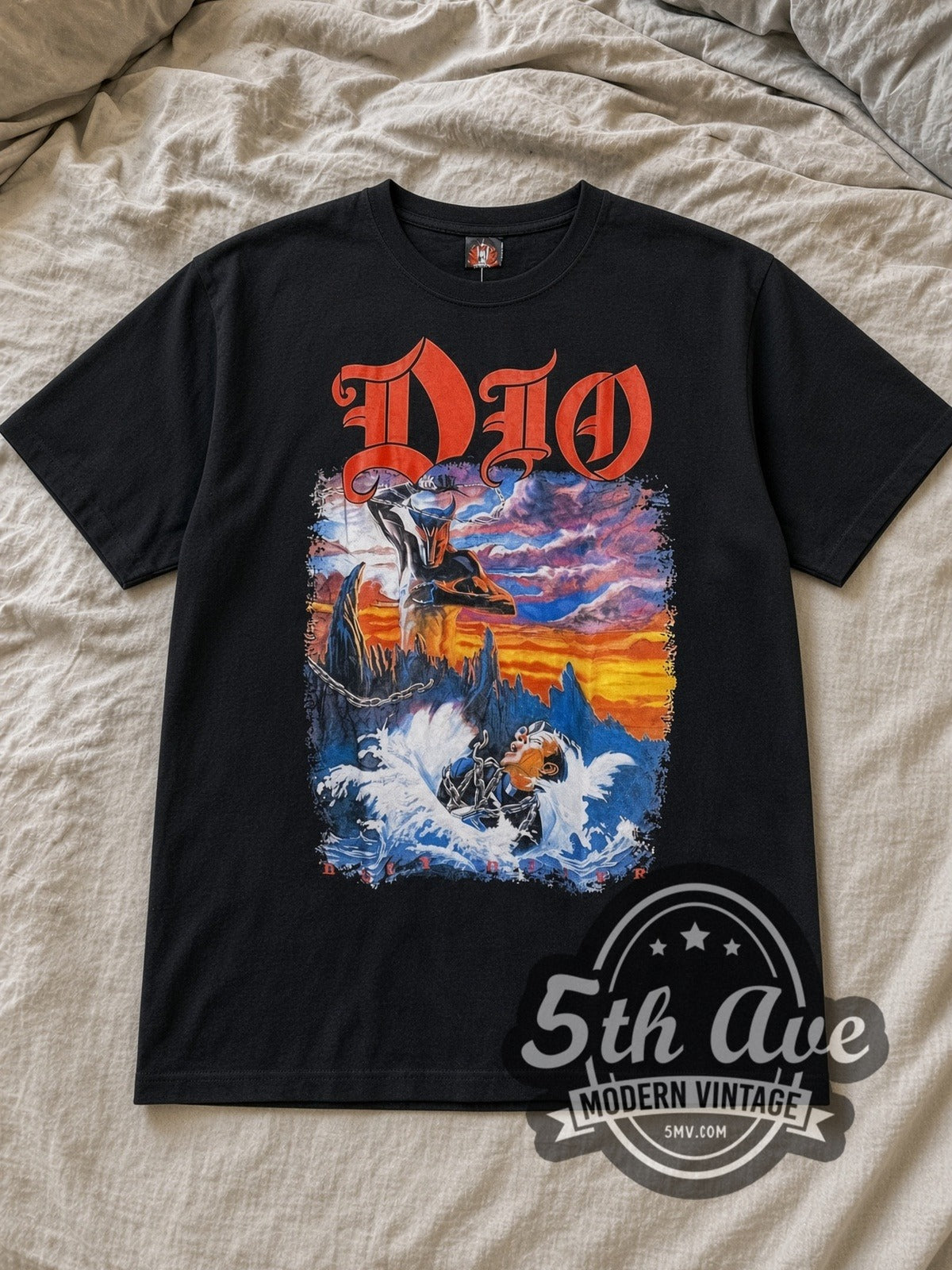 Black Dio Holy Diver Full Scene Priest Drowning Vintage Band T-Shirt laid flat on a linen bed