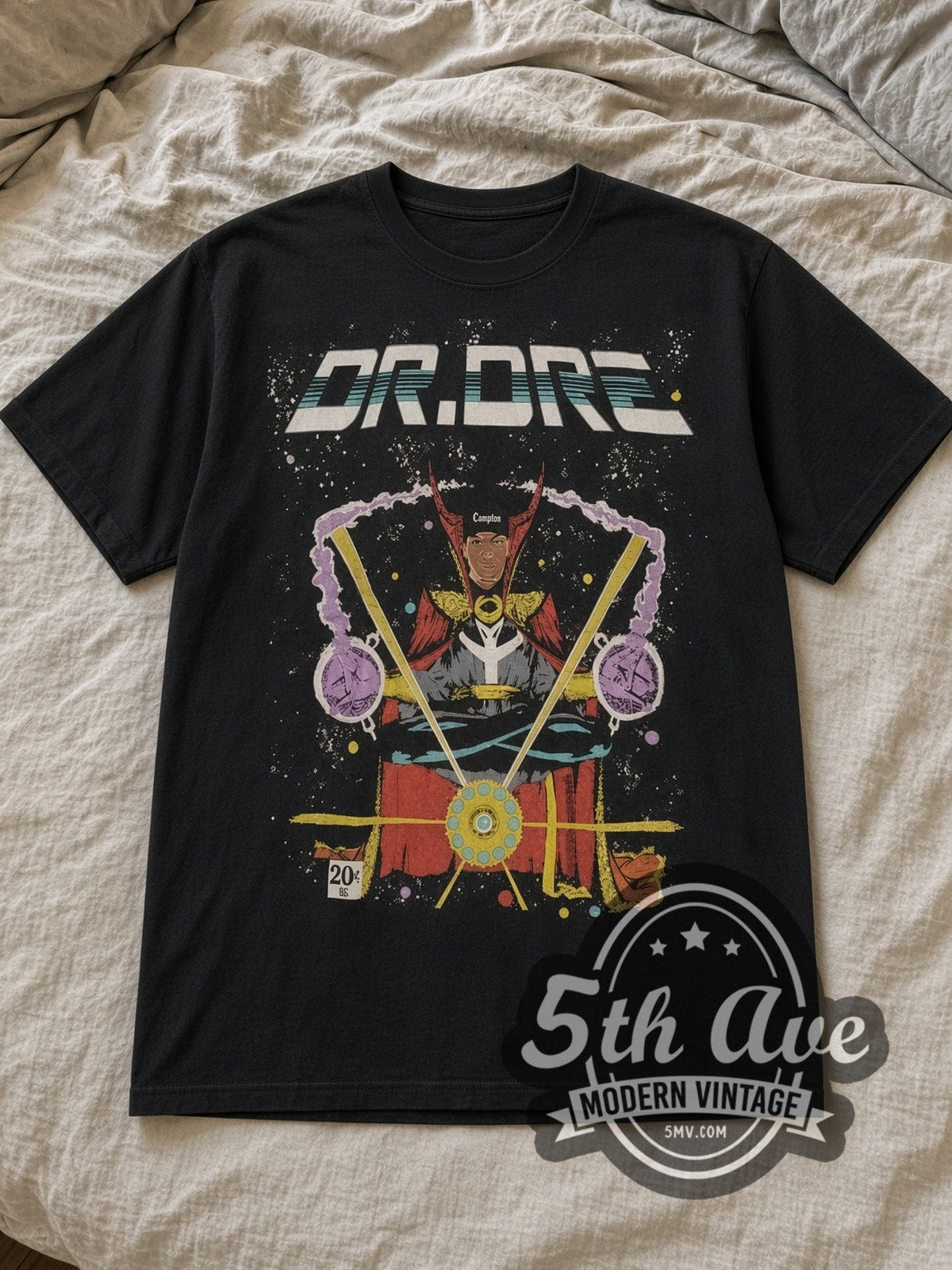 Black Dr. Dre Comic Style Portrait Vintage Rap Tee laid flat on a linen bed