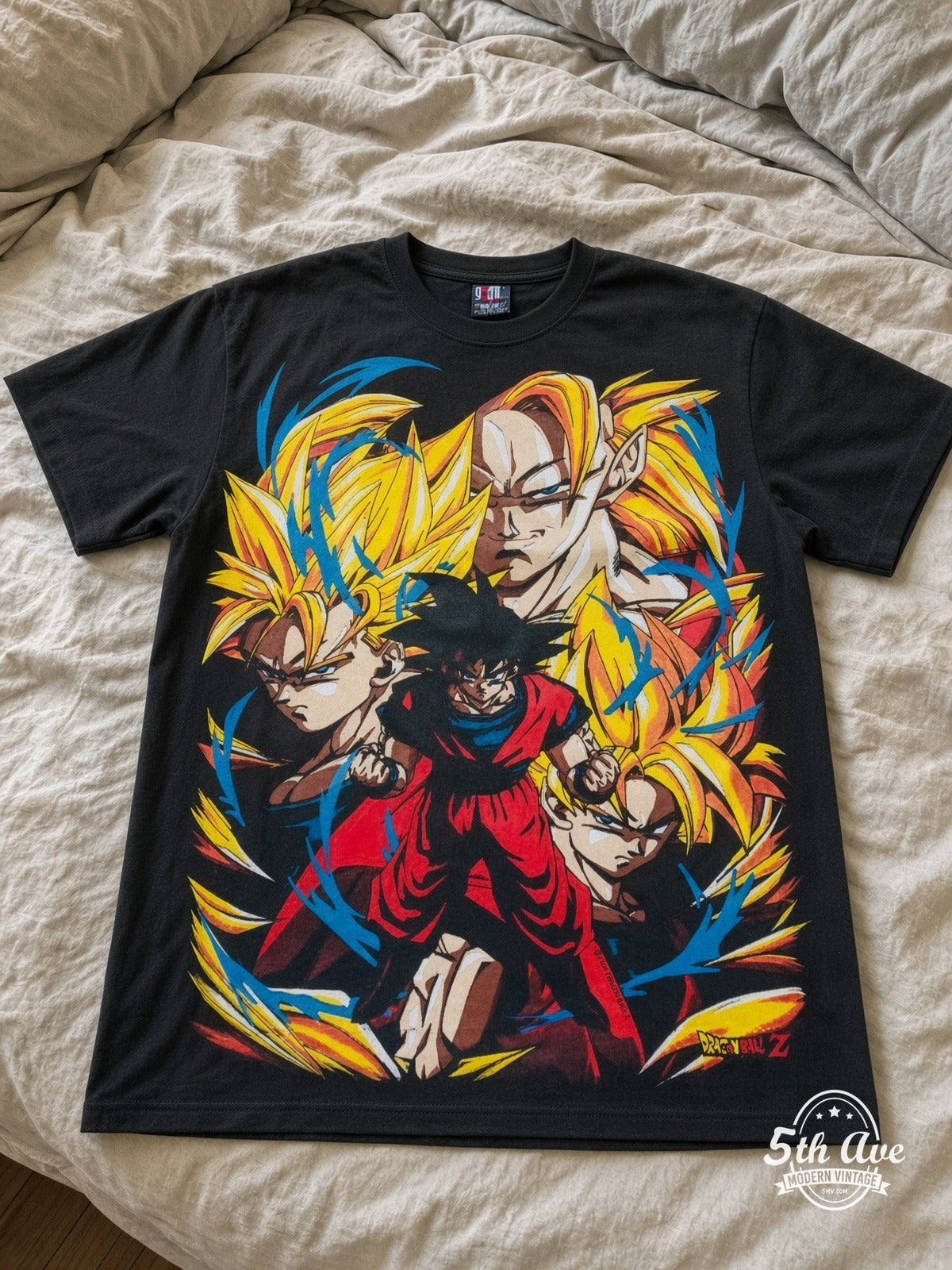 Dragon Ball Z Goku Super Saiyan Forms vintage tee laid on bed
