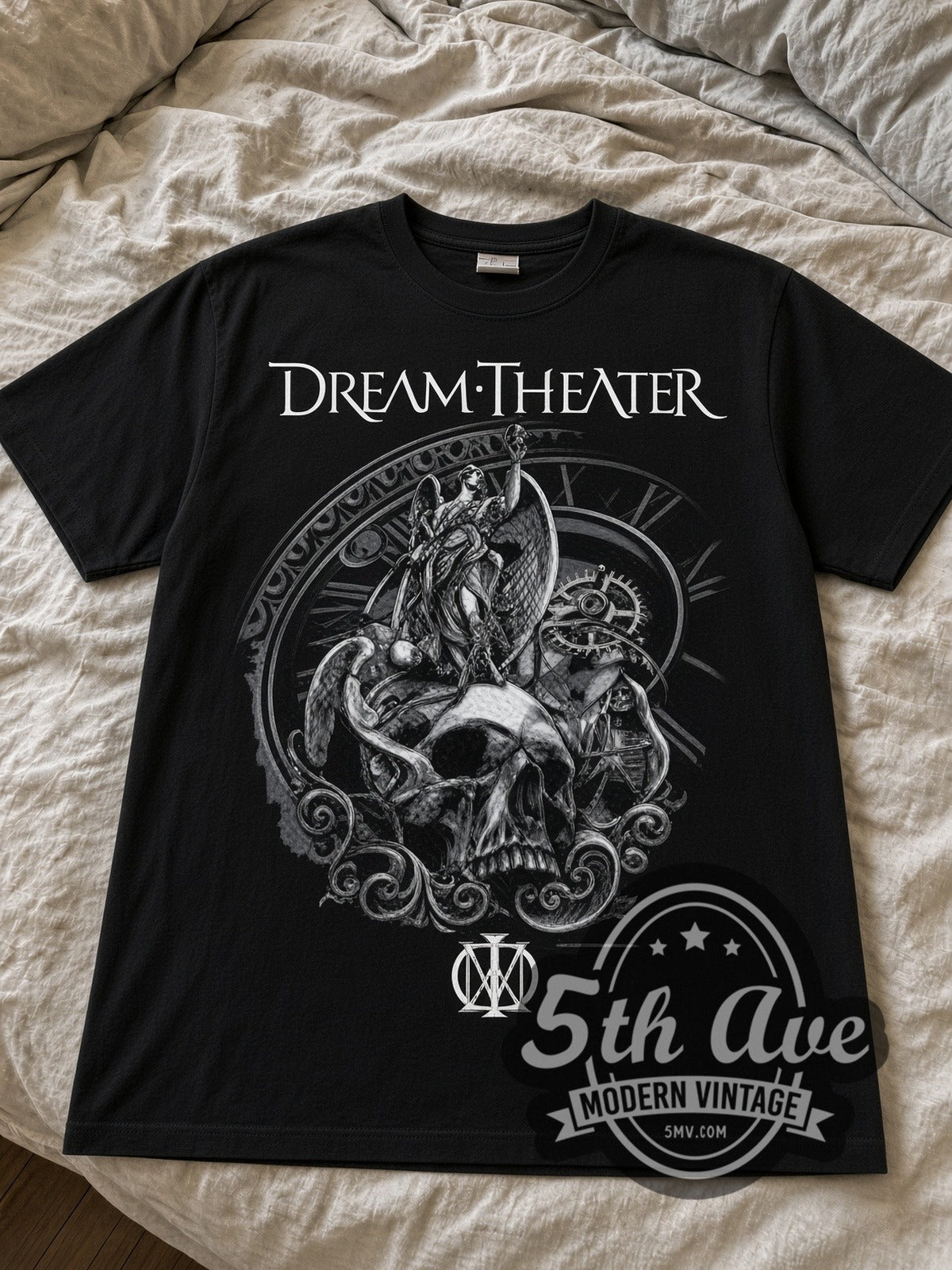 Dream Theater Skull and Clockwork black graphic tee laid flat on linen bed