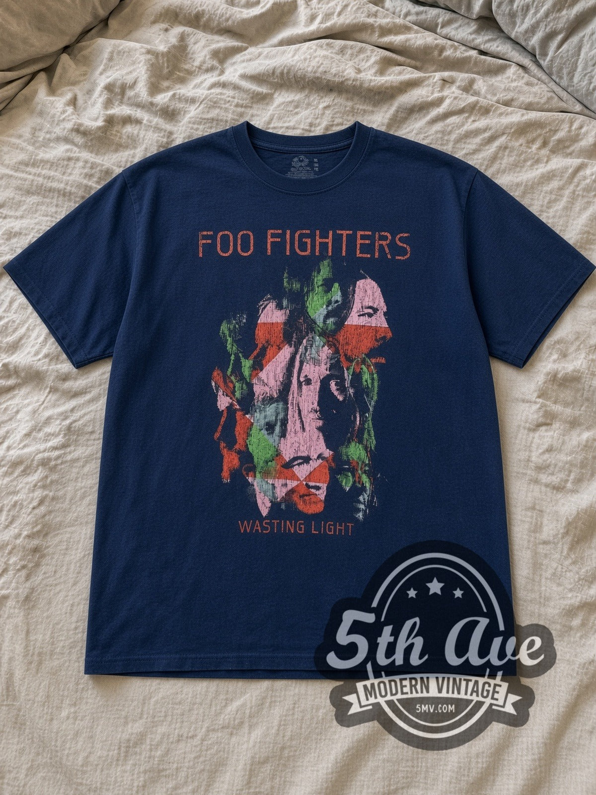 Navy Foo Fighters Wasting Light Vintage Band T-Shirt laid flat on a linen bed