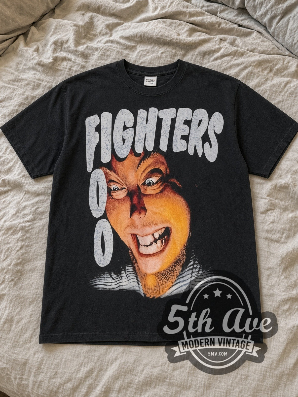 Black Foo Fighters Exhausted Vintage Band T-Shirt laid flat on a linen bed
