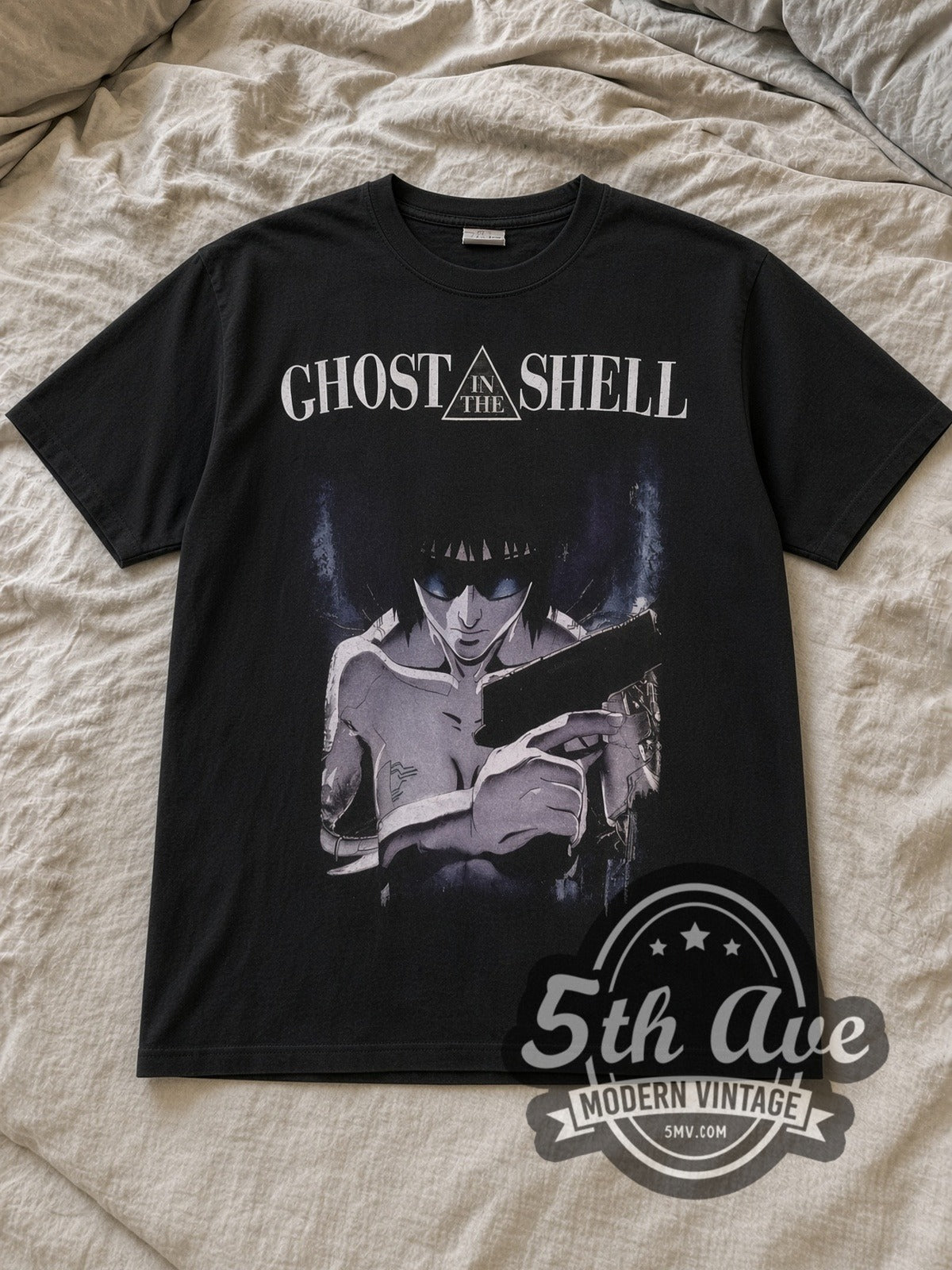 Black Ghost In The Shell Classic Vintage Anime T-Shirt laid flat on a linen bed