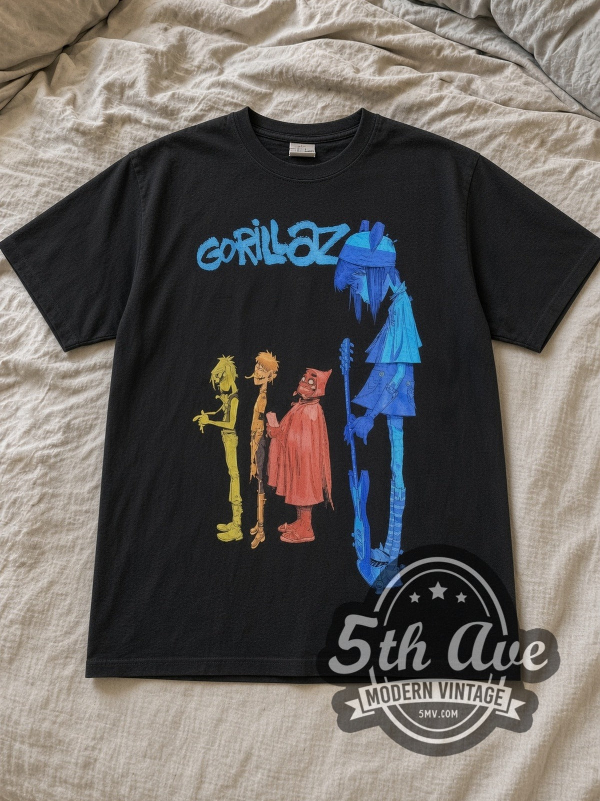 Black Gorillaz Four Color Profile Lineup Vintage Band T-Shirt laid flat on a linen bed