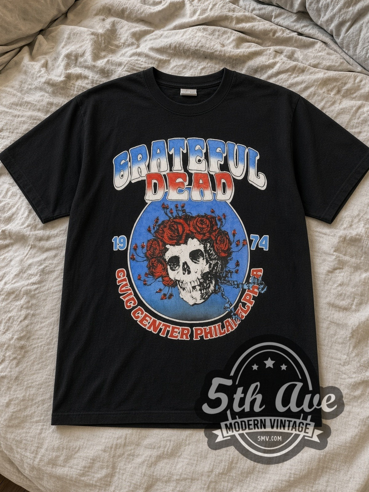 Black Grateful Dead Live at Philadelphia Civic Center 1974 Vintage Band T-Shirt laid flat on a linen bed