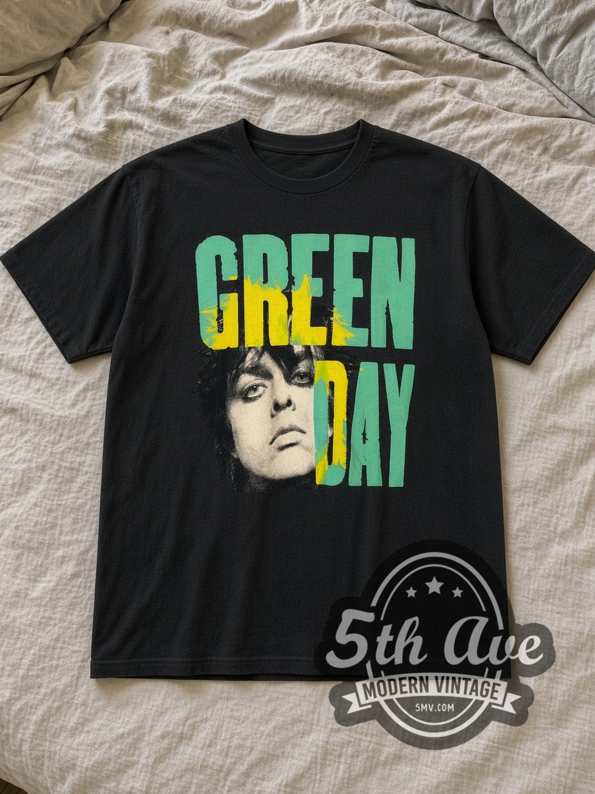 Black Green Day Billie Joe Portrait Teal Yellow Splash Vintage Band T-Shirt laid flat on a linen bed