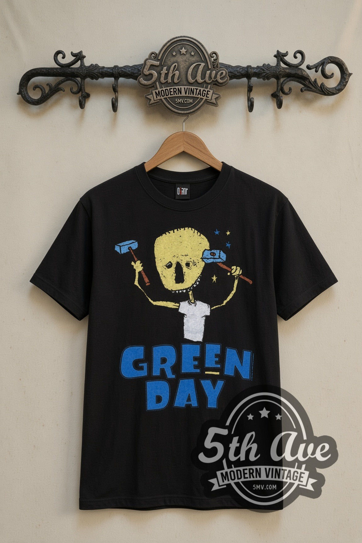 Green Day Nimrod Hammer Skull vintage band t-shirt in black, front view on a display rack