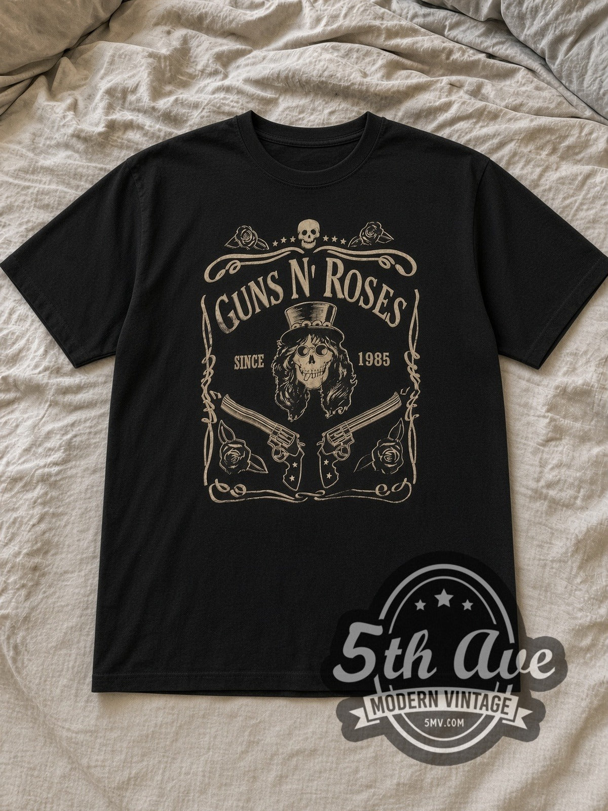 Black Guns N' Roses Est. 1985 Skull Label Vintage Band T-Shirt laid flat on a linen bed