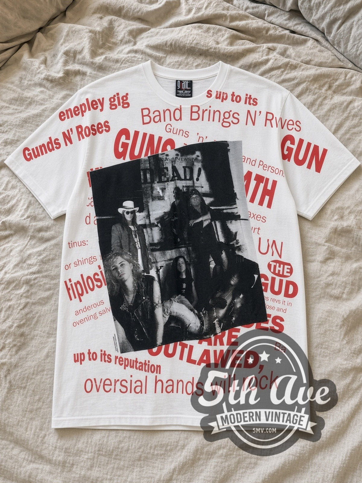 White Guns N' Roses DEAD Newspaper Headlines White All Over Print Vintage Band T-Shirt laid flat on a linen bed