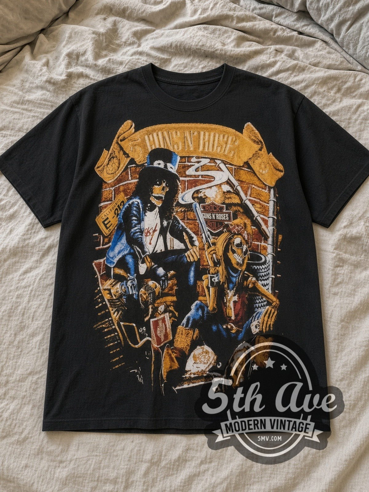 Black Guns N' Roses Retro Band Illustration Vintage Band T-Shirt laid flat on a linen bed