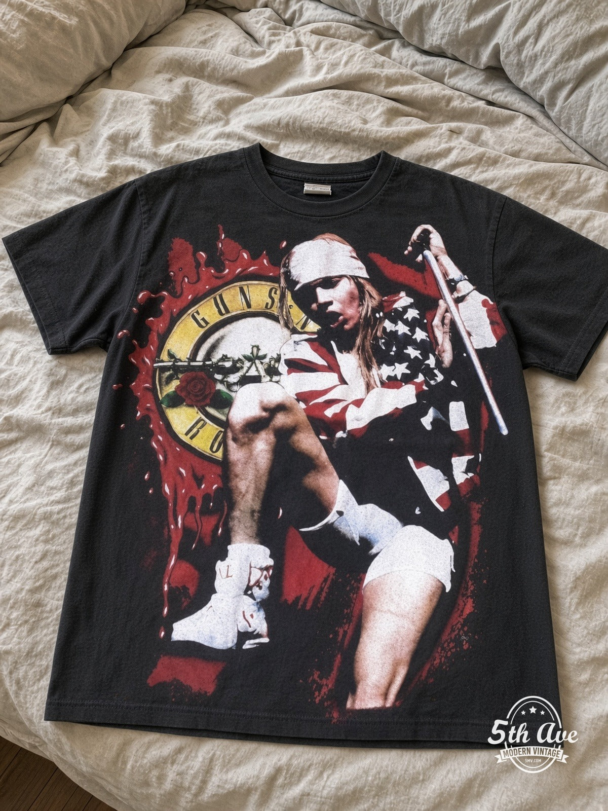 Guns N' Roses Axl Circular Logo all over print vintage tee laid on bed