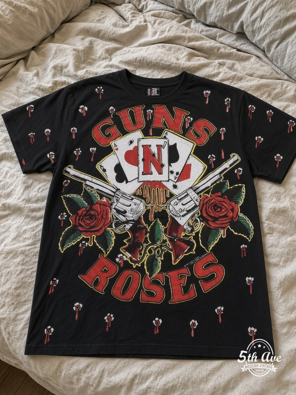Guns N' Roses Bullet Logo Repeat all over print vintage tee laid on bed