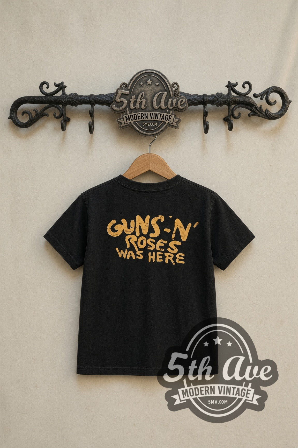 Guns N' Roses Bullet Logo Was Here kids band tee in black, back view on a display rack