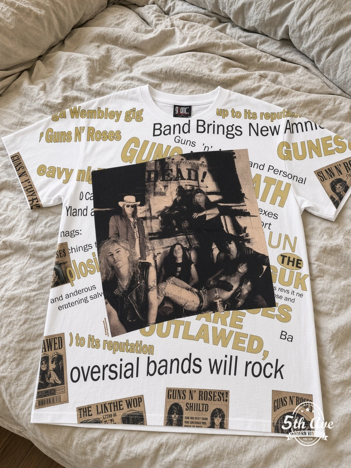 Guns N' Roses Newspaper Outlawed all over print vintage tee laid on bed