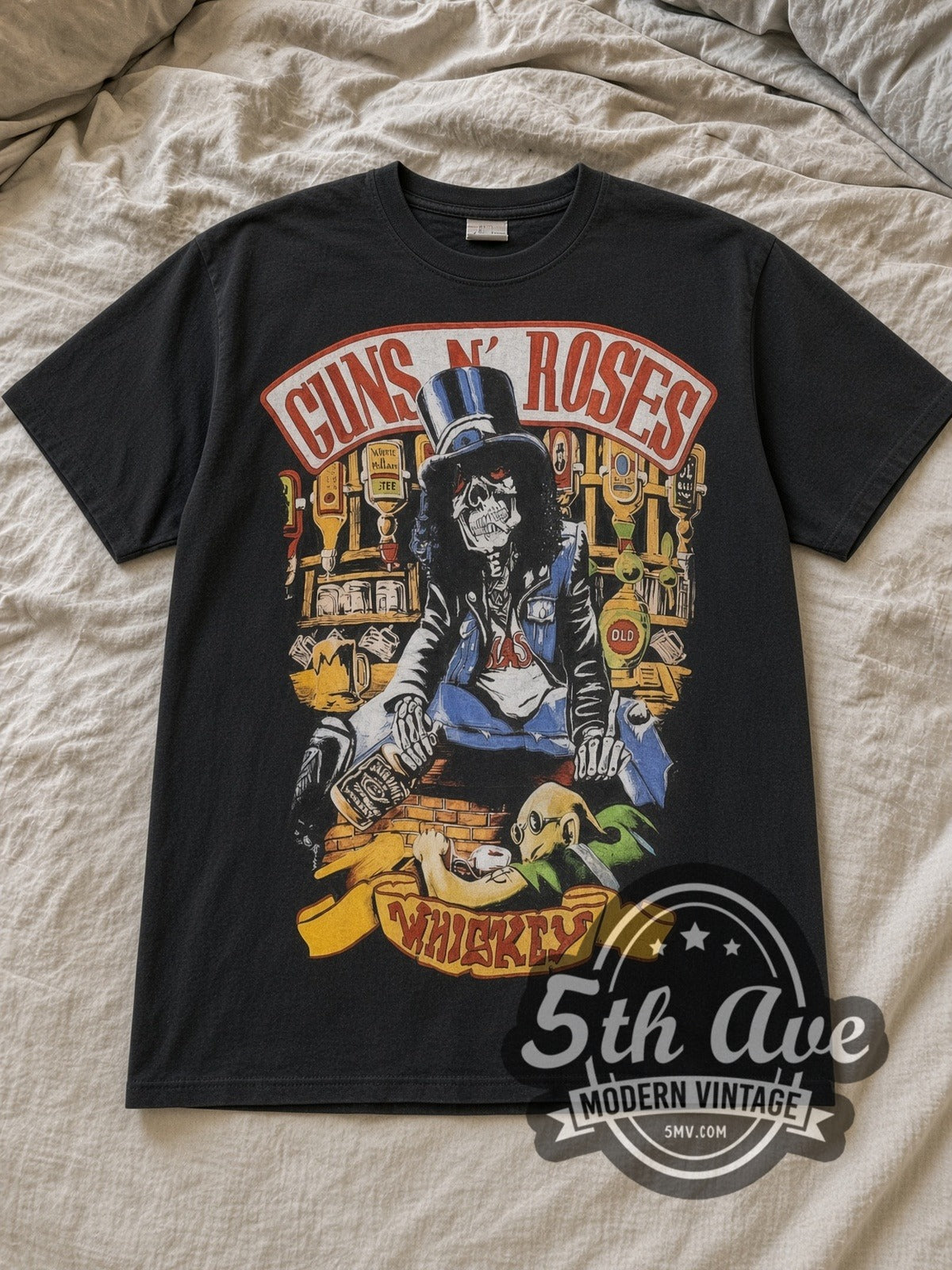 Black Guns N' Roses Whiskey All Over Print Vintage Band T-Shirt laid flat on a linen bed