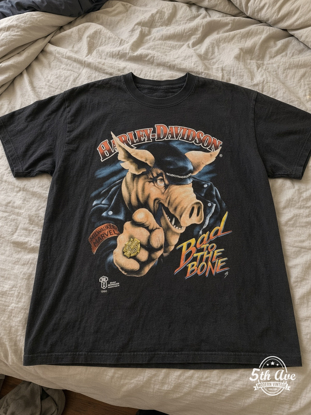 Harley-Davidson Bad to the Bone Lake Shore Waukegan IL vintage tee laid on bed