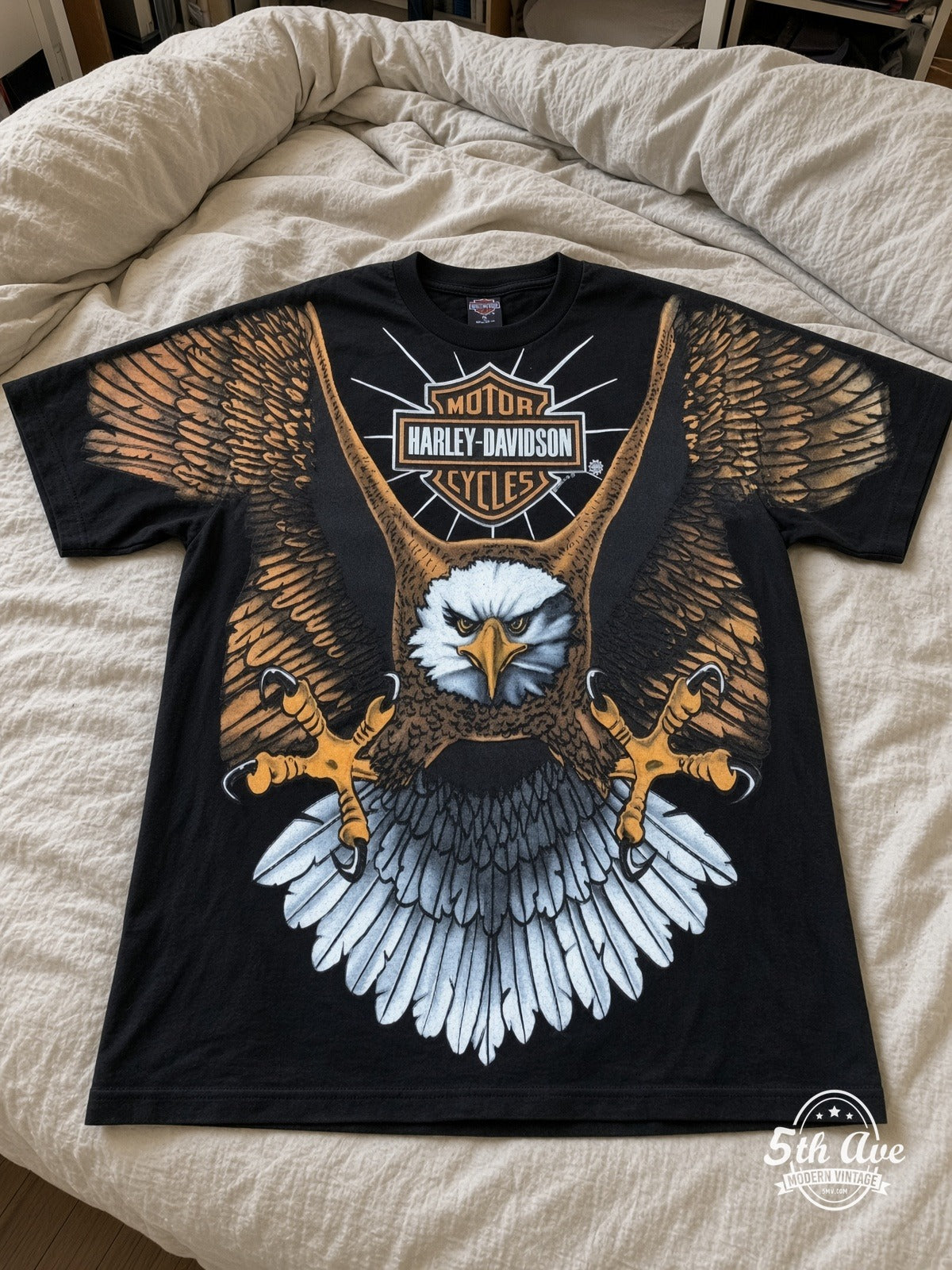 Harley-Davidson Bald Eagle Bar Shield all over print vintage tee laid on bed
