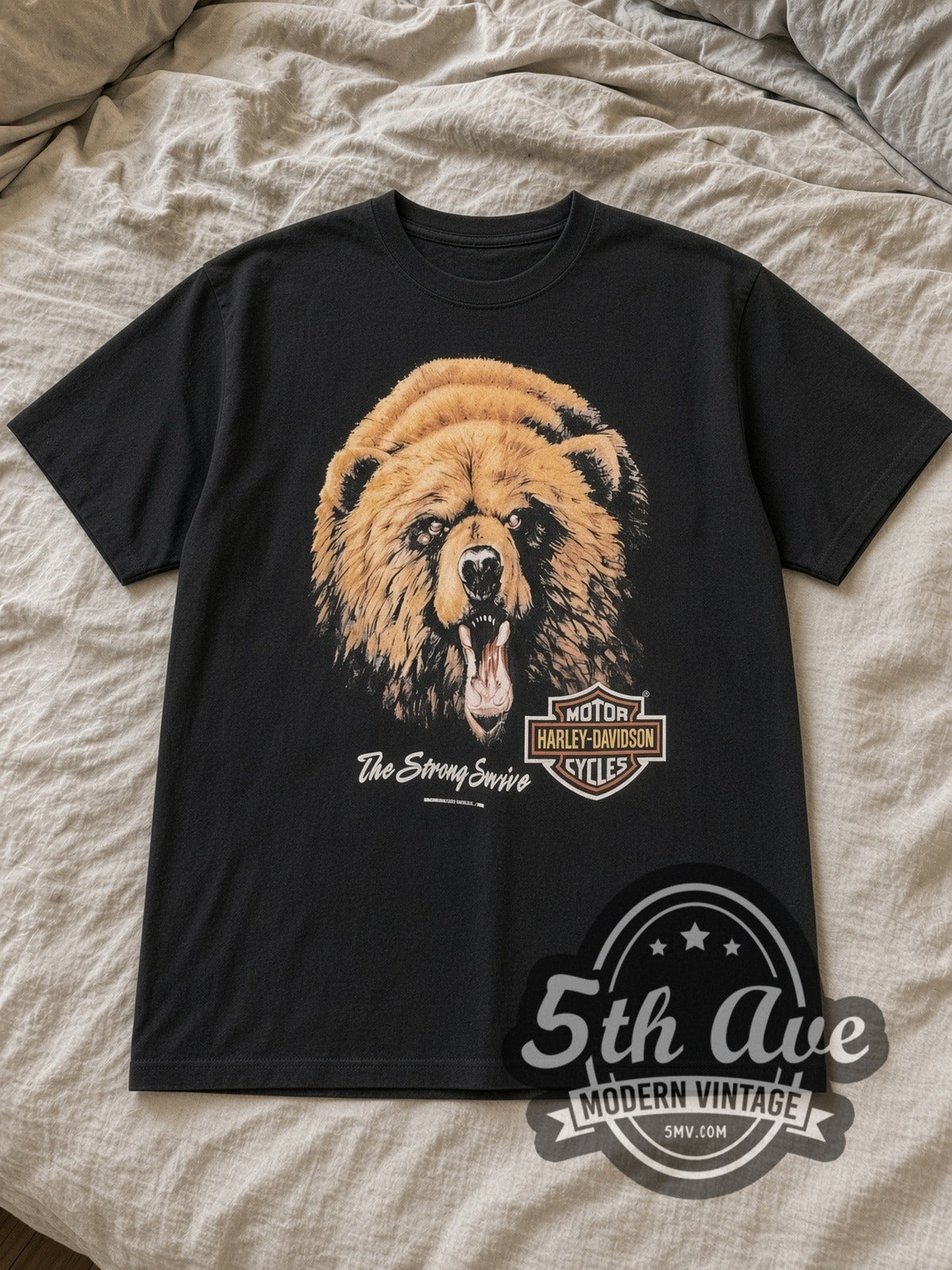 Black Harley Davidson The Strong Survive Lake Shore, Waukegan, IL Vintage Harley-Davidson T-Shirt laid flat on a linen bed