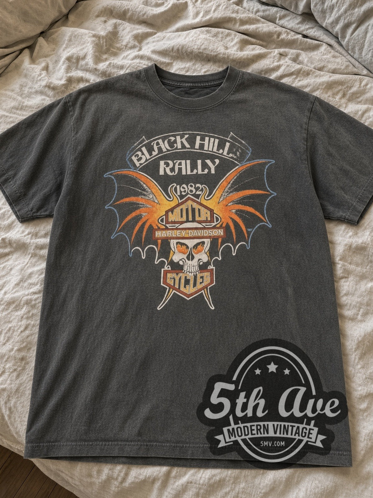 Faded Black Harley-Davidson Black Hills Rally 1982 / Rapid City S.D. vintage Harley tee laid flat on linen bed