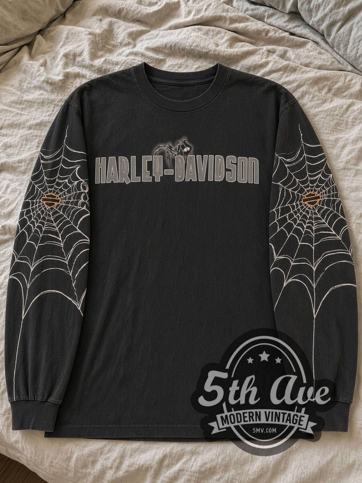 Black Harley-Davidson Chicago Spider Wordmark & Skyline long sleeve tee laid flat on linen bed
