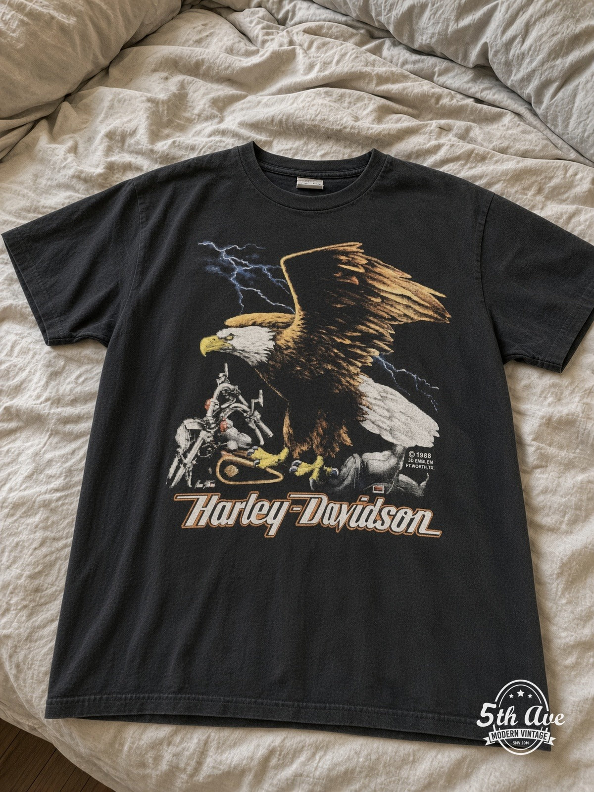 Harley-Davidson Lake Shore Waukegan Eagle vintage tee laid on bed