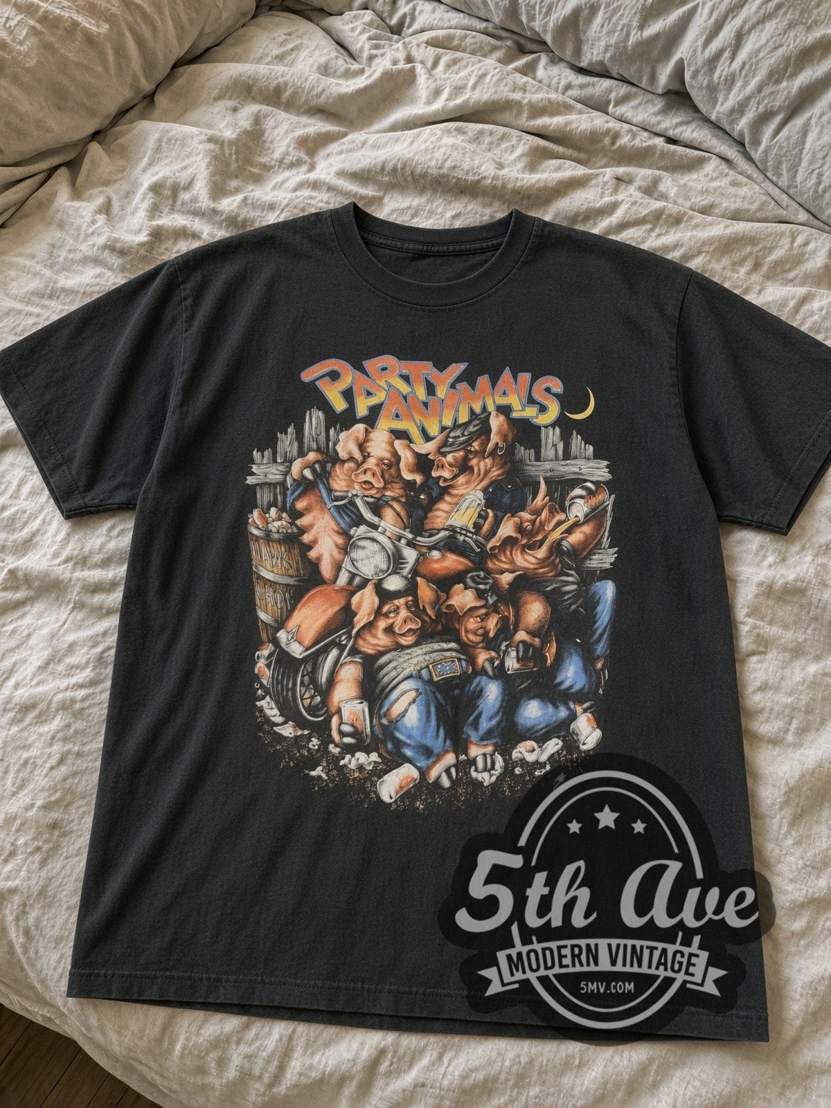 Faded black Harley-Davidson Party Animals pigs tee laid flat on bed