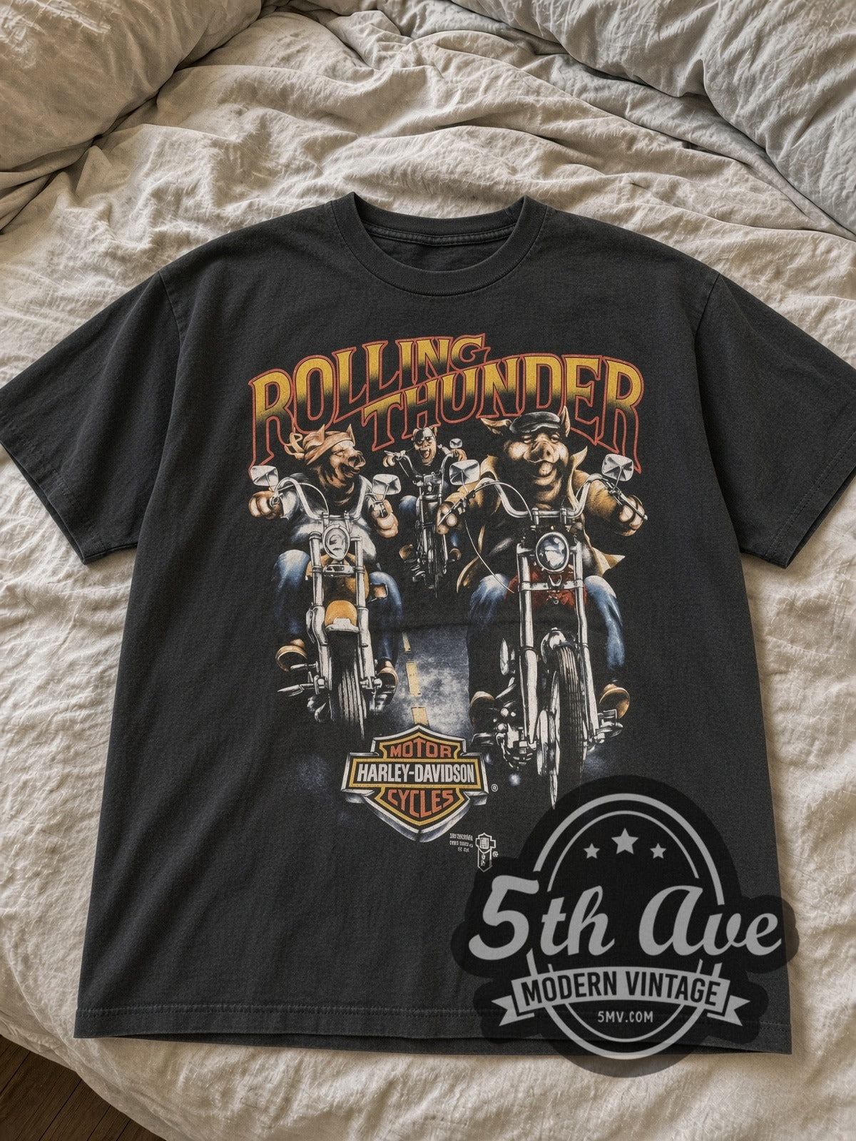 Faded black Harley-Davidson Rolling Thunder pigs tee laid flat on bed