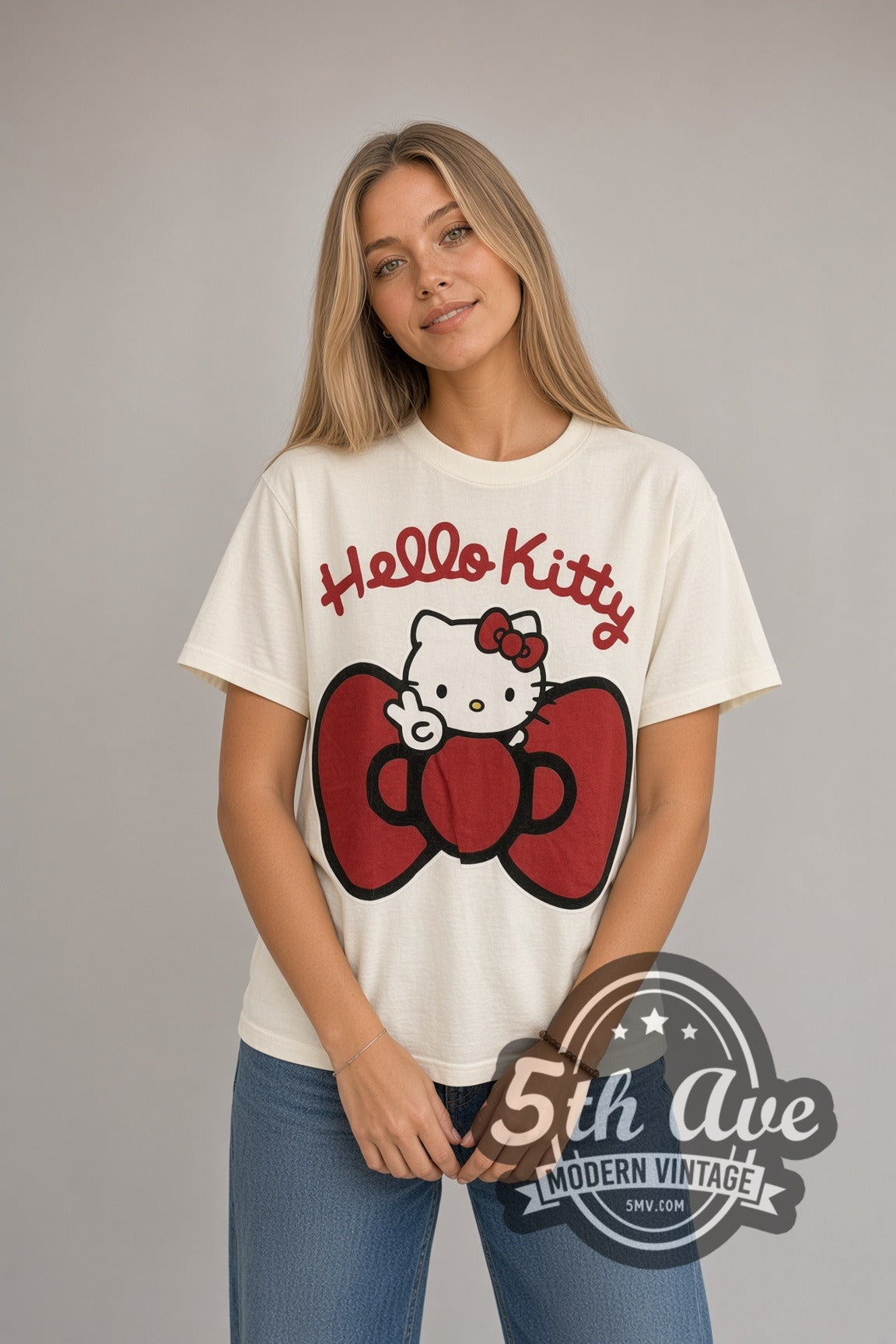 Woman wearing cream Hello Kitty Big Red Bow Front & Back vintage cartoon tee