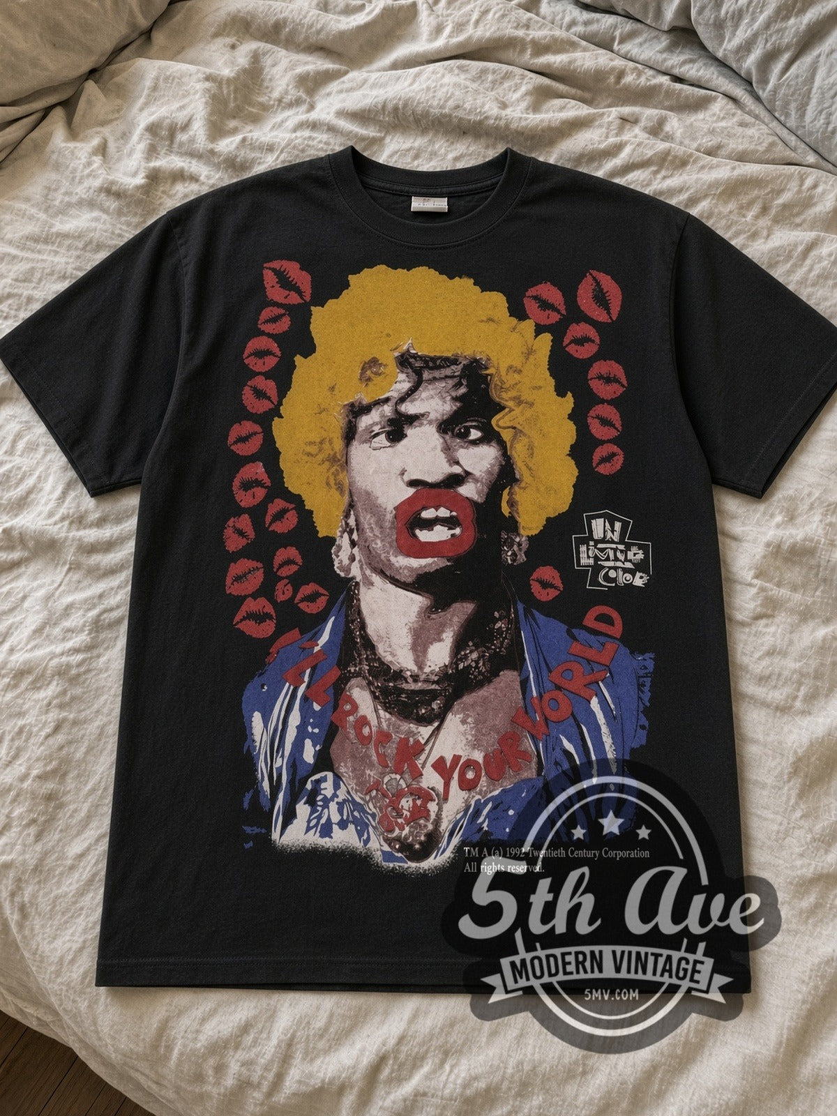 Black In Living Color Mosquitohead Vintage Movie T-Shirt laid flat on a linen bed